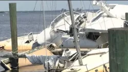 Damaged boats sit at Old Bridge Marina in North Fort Myers