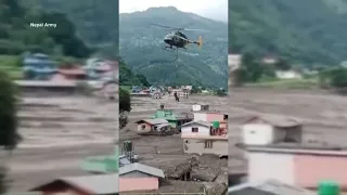 Rescuers searching for survivors and thousands missing in Nepal floods