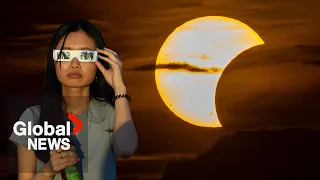 Crowds gather for rare celestial event in Europe as solar eclipse reaches "totality"