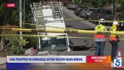 Spectrum van swallowed by sinkhole after water main break in Los Feliz