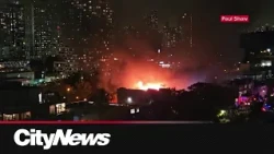 Massive fire rips through abandoned building in Riverside