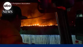 Fast-moving wildfires tear through multiple states