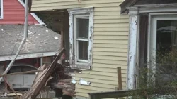 One dead after car strikes two homes in Ellsworth