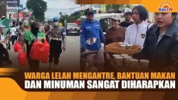 EXHAUSTED RESIDENTS WAIT IN LINE, FOOD AND DRINK AID MUCH APPRECIATED