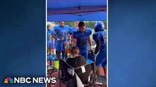 Good News: High school football team surprises mom fighting cancer with flowers