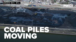 Inking a contract to move coal piles out of downtown Green Bay