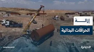 Al-Ekhbariya correspondent in Deir ez-Zor discusses details of dismantling primitive oil refineri...