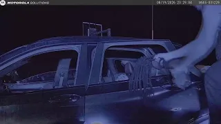 Dashcam footage shows Arkansas State Police officer attempt to drag man out of broken car window aft
