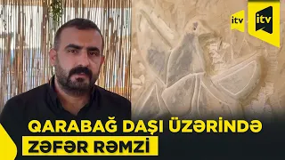 Artist from Igdir carves Khari Bulbul, symbol of victory, onto stone brought from Karabakh