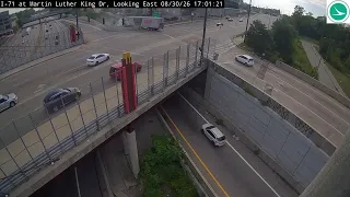 Semi goes over barrier on I-71