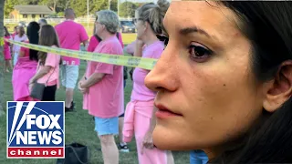 HUNDREDS rally in support of mom accused of murdering her children
