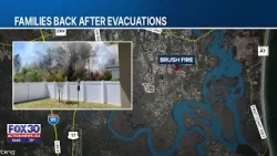 Жители округа Нассау возвращаются домой после эвакуации, вызванной лесным пожаром.