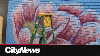 Mural artists popping out during Edmonton Mural Festival