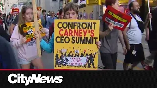 Protest targets Canada investment summit in downtown Toronto