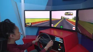 Driving instructors test distracted driving simulator at annual summit