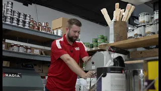 Local Hallman Lindsay donates paint to De Pere High School repair