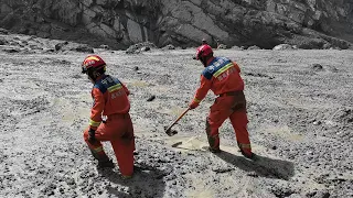Rescuers battle deep mud to find missing people after China-Nepal mudslides