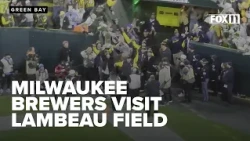 World Series Champion Milwaukee Brewers walk on Lambeau Field with Commissioner's Trophy