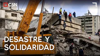 VENEZUELA: VOLUNTEER neighbors clear RUBBLE with their HANDS