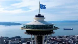 Mayor Wilson raises the 12th Man flag atop the Space Needle