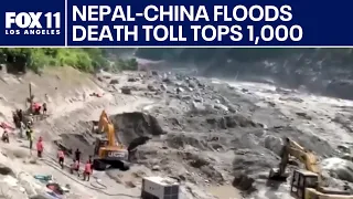 Mass burials in Nepal as death toll from flash floods exceeds 1,000