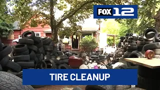 SE Portland homeowner works to clear away tires, trash dumped on his property