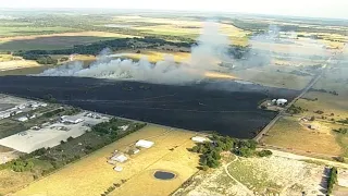 Grass fire burns around Ferris church, buildings remain untouched