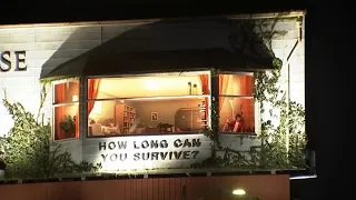 Man living inside billboard on Sunset Boulevard in LA to promote film draws spectators