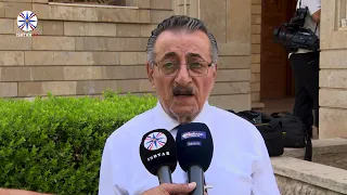 A moment of silence in front of St. Joseph Chaldean Cathedral in Ankawa, commemorating the 93rd a...