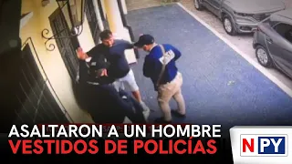 Man robbed by individuals posing as police officers