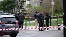 Macron denounces deadly shooting near Paris as 'racist terrorist attack'