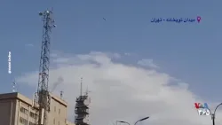 موشک‌ها در آسمان منطقه توپخانه تهران و چند شهروند در حال حدس زدن مقاصد احتمالی موشک‌ها