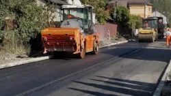 Asphalt being laid on Szczakowska Street. Road reconstruction is nearing completion