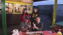 Corndog eating contest at Roseville's Denios Market for National Something On a Stick Day