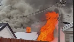 Neighbor uses sledgehammer to smash through front door, carry woman from fire in Arlington Heights