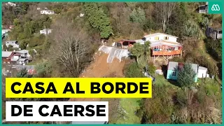 House on the verge of collapse in Corral following landslides caused by heavy rain