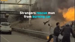 Strangers rescue man from burning car