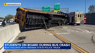 11 hospitalized after school bus, Indiana State Police truck crash