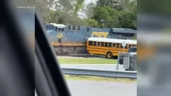 Video: School bus driver arrested after driving bus onto train tracks