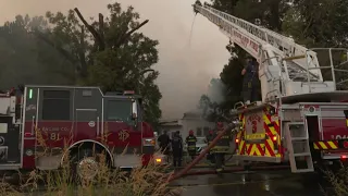 Firefighters battle house fire near Winters