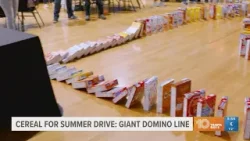 Giant domino line of cereal boxes falls to celebrate Cereal for Summer