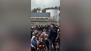 Video shows migrants running towards temporary camp in Ceuta