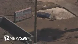 Car ends up in apparent sinkhole after crash in west Phoenix