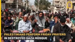 Palestinians perform Friday prayers in destroyed mosque in Gaza