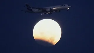 Portugal: A partial lunar eclipse illuminates the sky over Lisbon