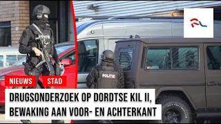 Drug investigation at business, heavily armed police guard premises