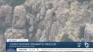 Flight medic dangles from helicopter rope in dramatic rescue