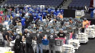 Volunteers pack thousands of meals in Tampa for 9/11 Day of Service