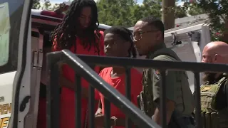 Suspects charged in deputy killing appear in court