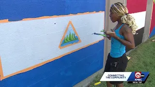 Northeast Kansas City's international flag mural restored with help from volunteers